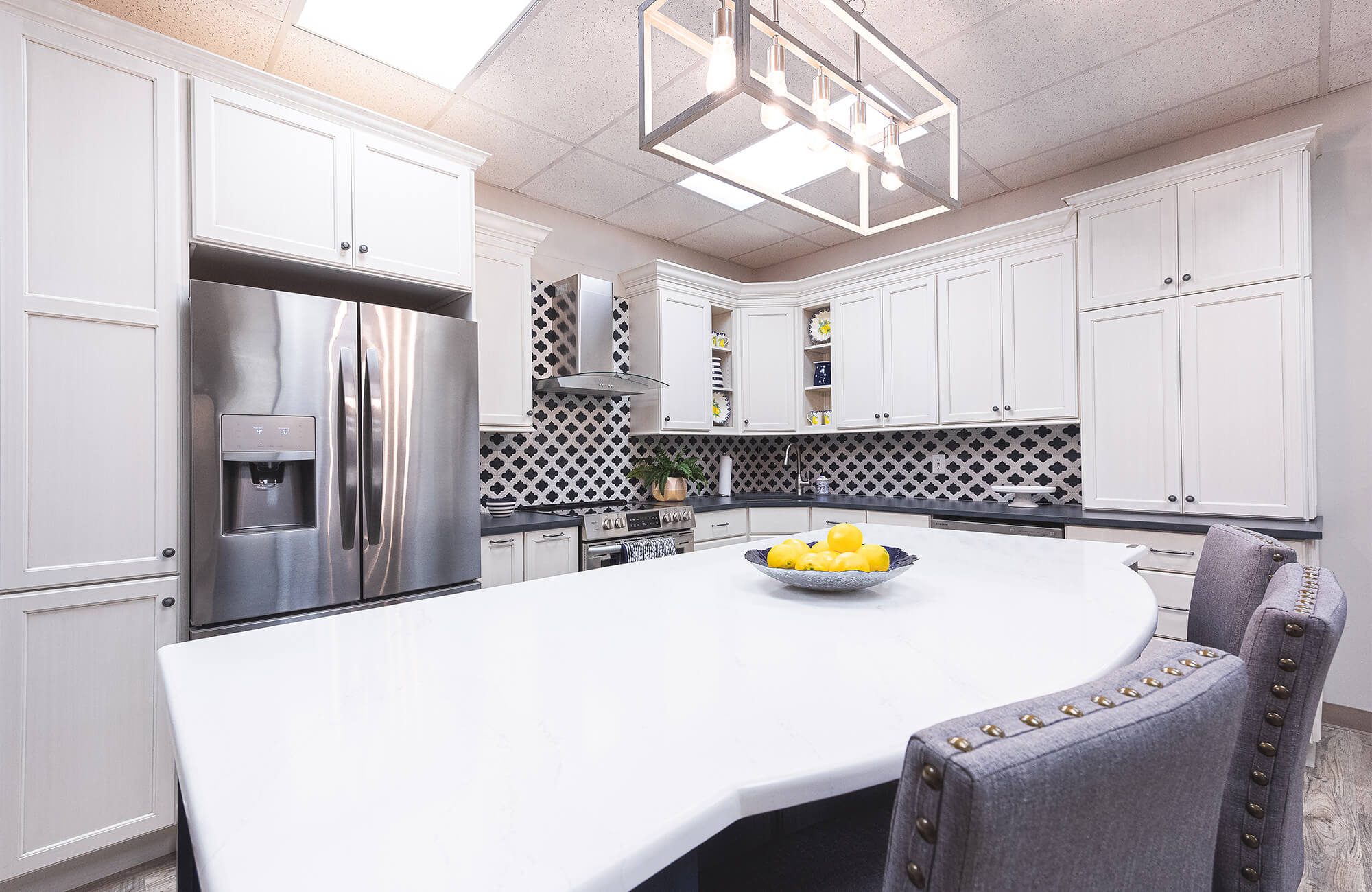 Large bright white and black showroom kitchen